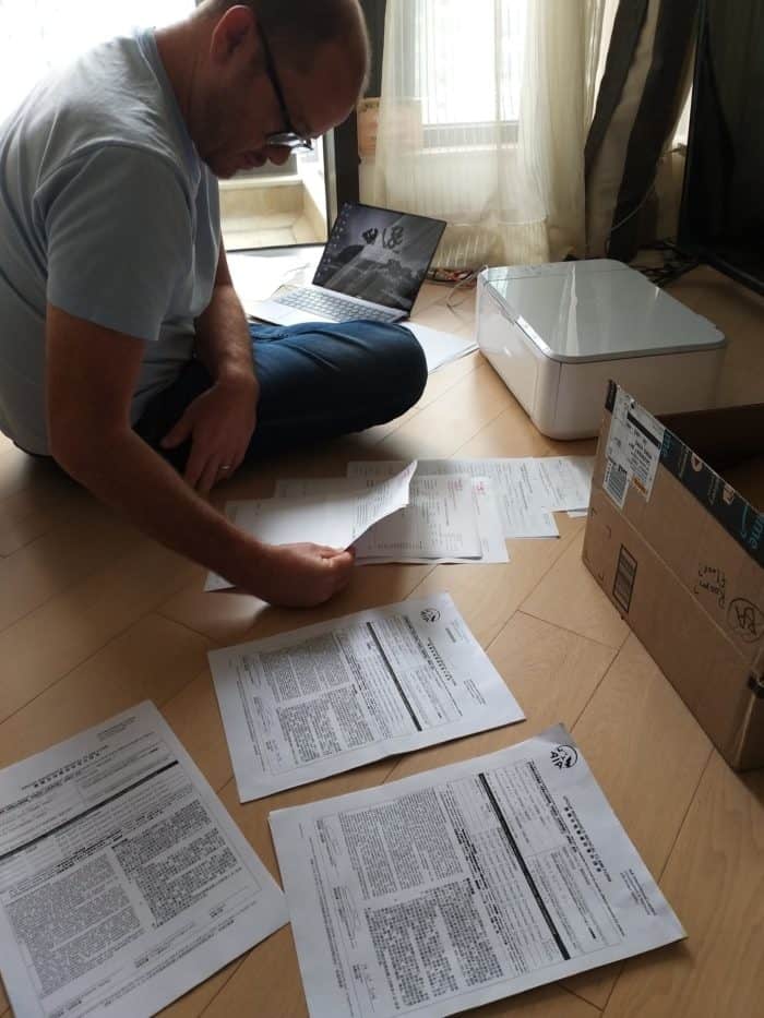Brad sorting through insurance paperwork