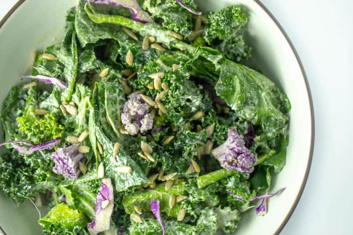 Cancer fighting raw vegan kale broccolini salad with lemon tahini dressing