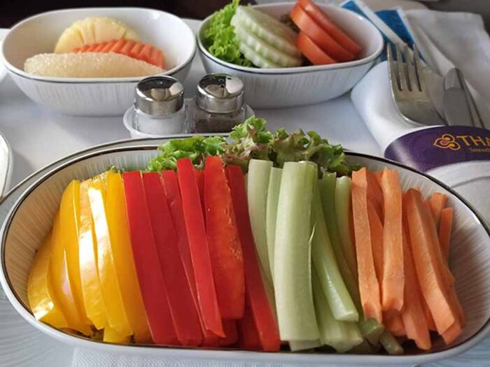 Ordering the raw vegan option on a flight can help you keep your diet while traveling